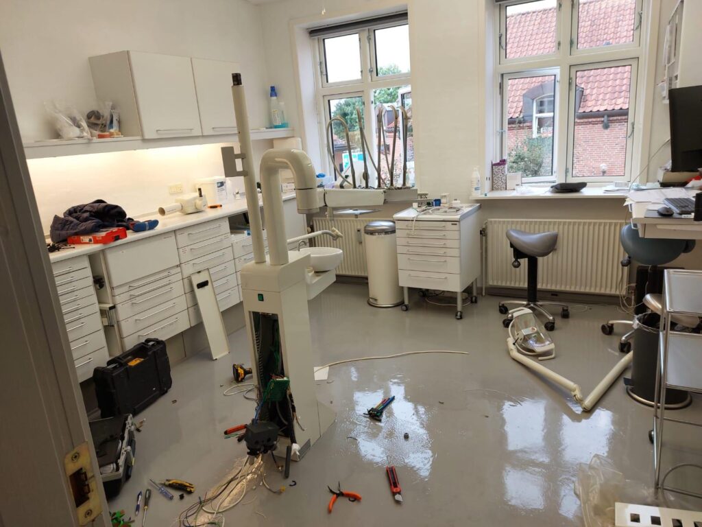 Bioden technician inspecting dental equipment during an on-site service call in Vancouver