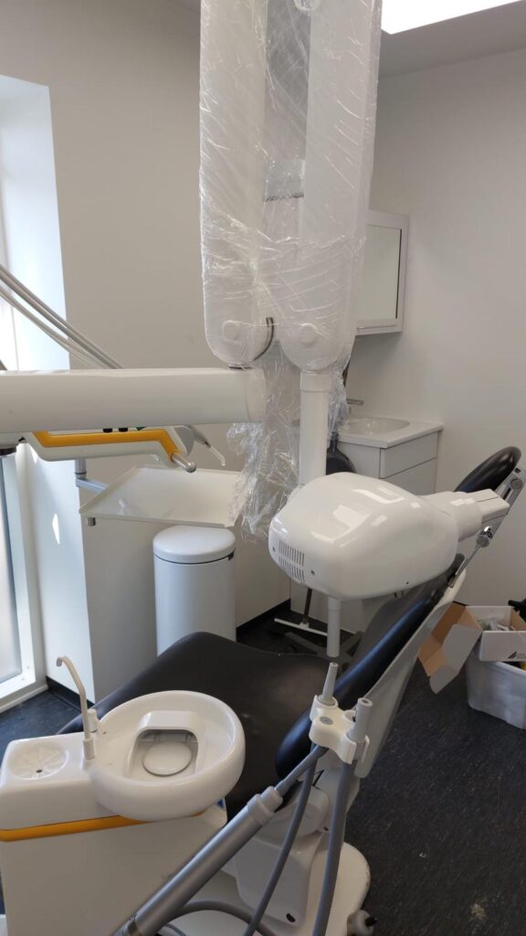 echnician repairing an intraoral dental X-ray unit at a Vancouver dental office