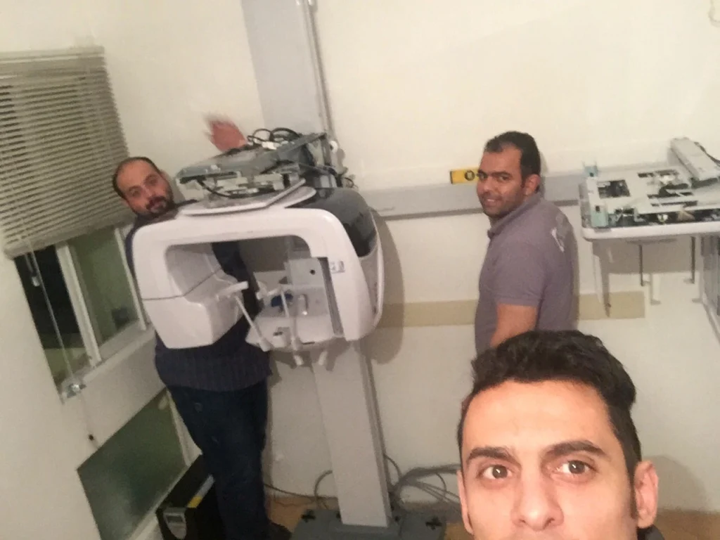 Bioden technician repairing a panoramic dental OPG X-ray unit in a Vancouver clinic