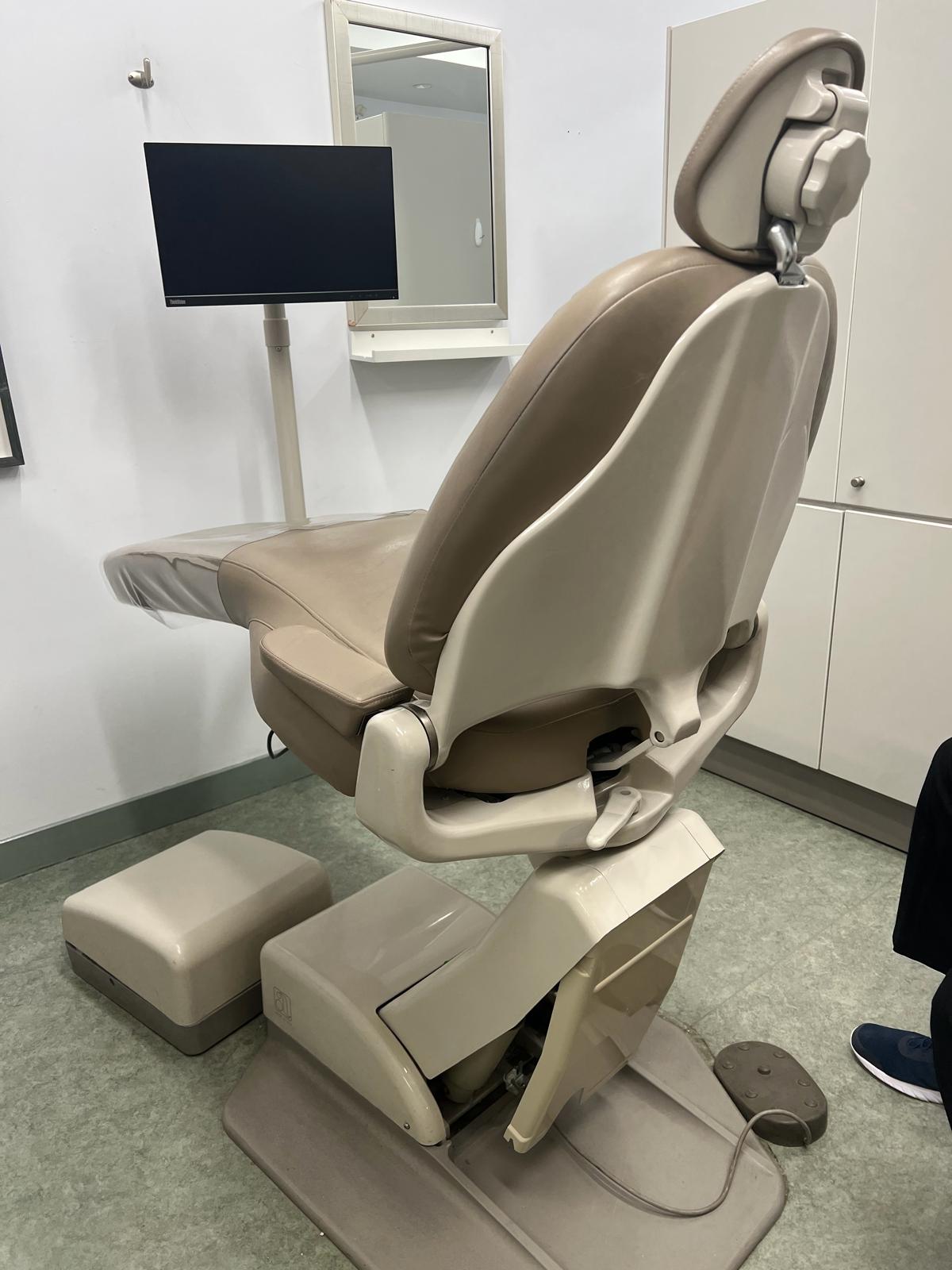 BioDen technician performing system diagnosis on a dental chair not going up in a Vancouver clinic